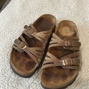 Birkenstock tan leather sandals.